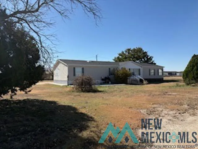 Home for sale at 511 Apache Trl, Portales, NM 88130 — 3 bed, 2 bath, 1,728 sqft on 1.5 acres